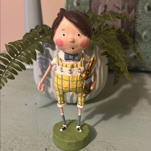 Whimsical Figurine with Yellow Checkered Outfit